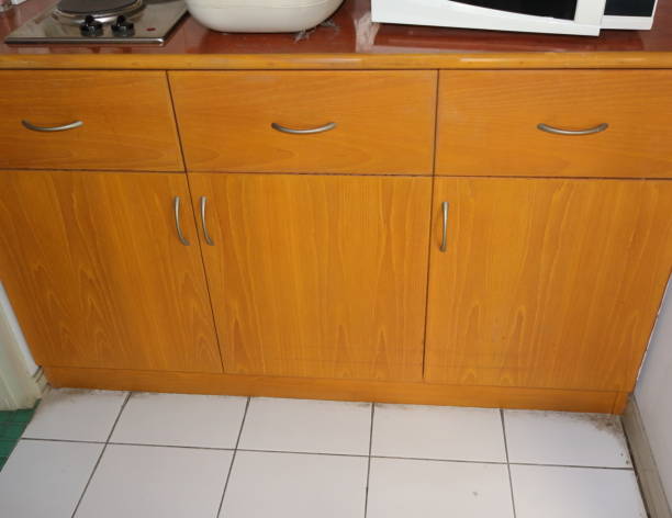 High angle view of built-in kitchen cabinet made from teak plywood, with formica countertop